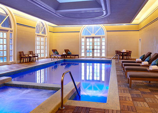 luxurious indoor pool with vibrant lighting