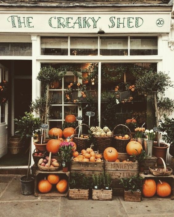 storefront with pumpkins